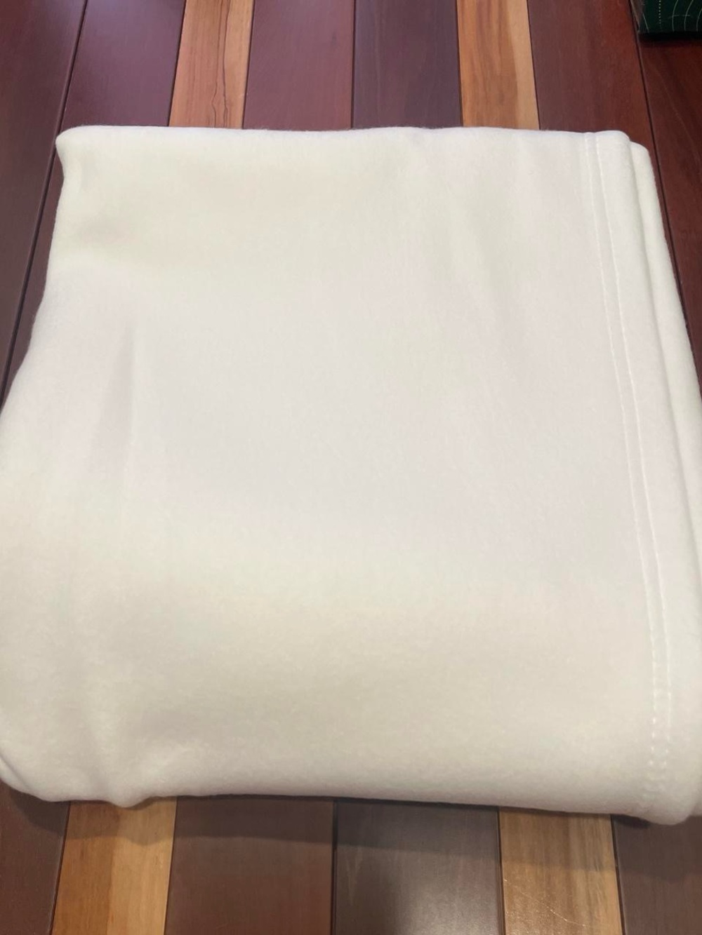 White Polyester throw blanket with Care Label